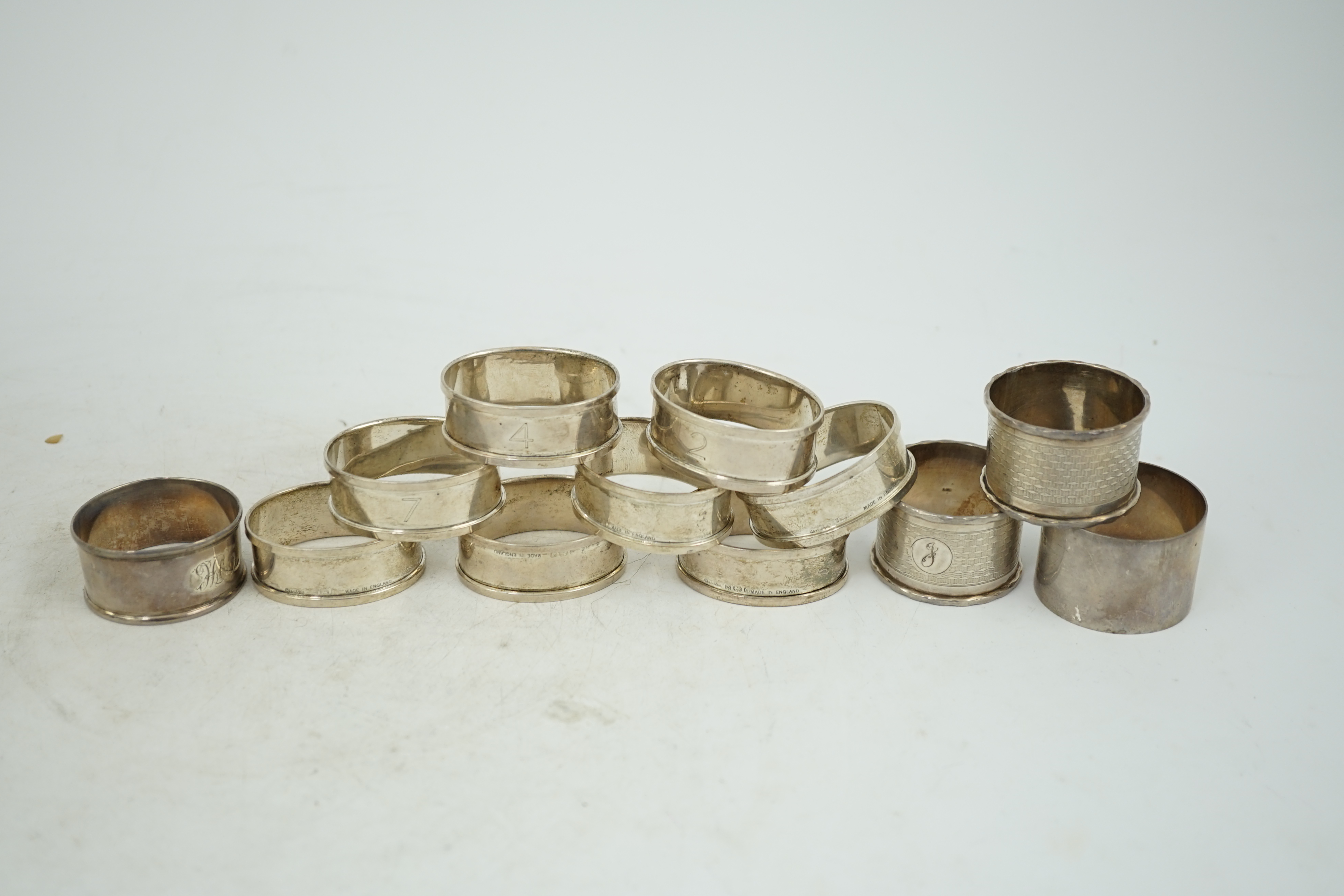 A matched set of eight early 1930's silver napkin rings and four other silver napkin rings including a pair, Birmingham, 1929, 5.3oz.